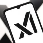 In this photo illustration, the xAI logo is seen displayed