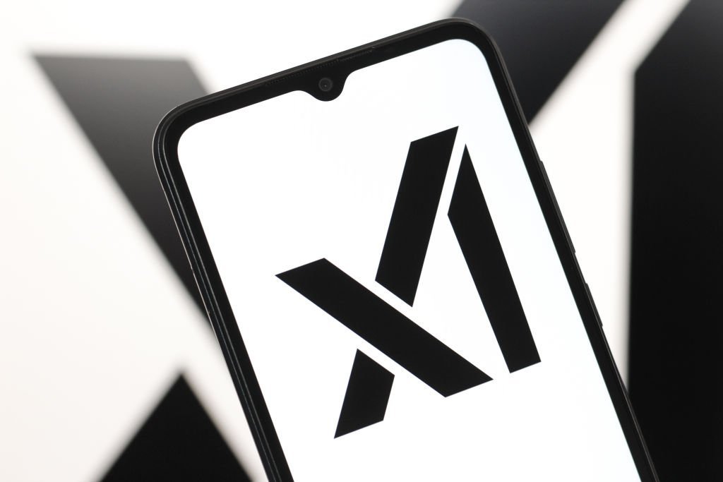 In this photo illustration, the xAI logo is seen displayed